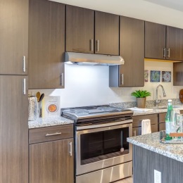 s kitchen with brown cabinets