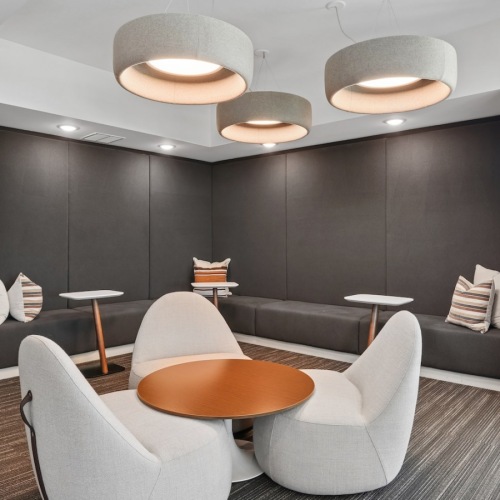 a clubroom with tables and chairs