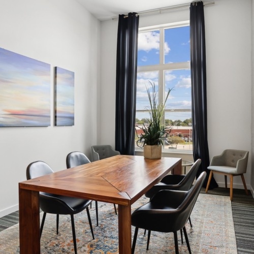 a room with a table and chairs