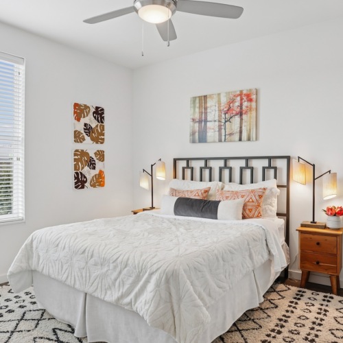 a bedroom with a bed and a window